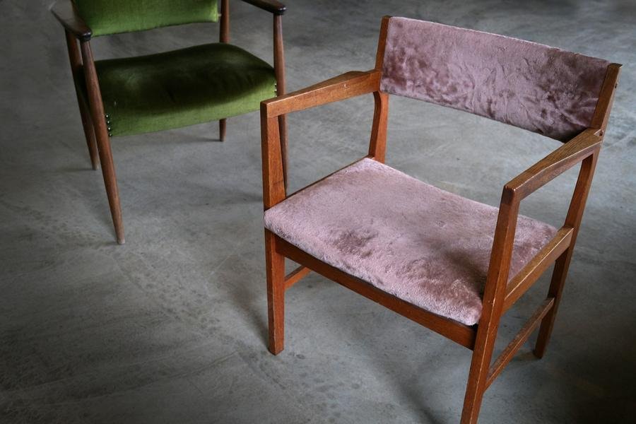 A repainted chair against a pink wall